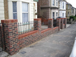New brick wall with iron railings 2